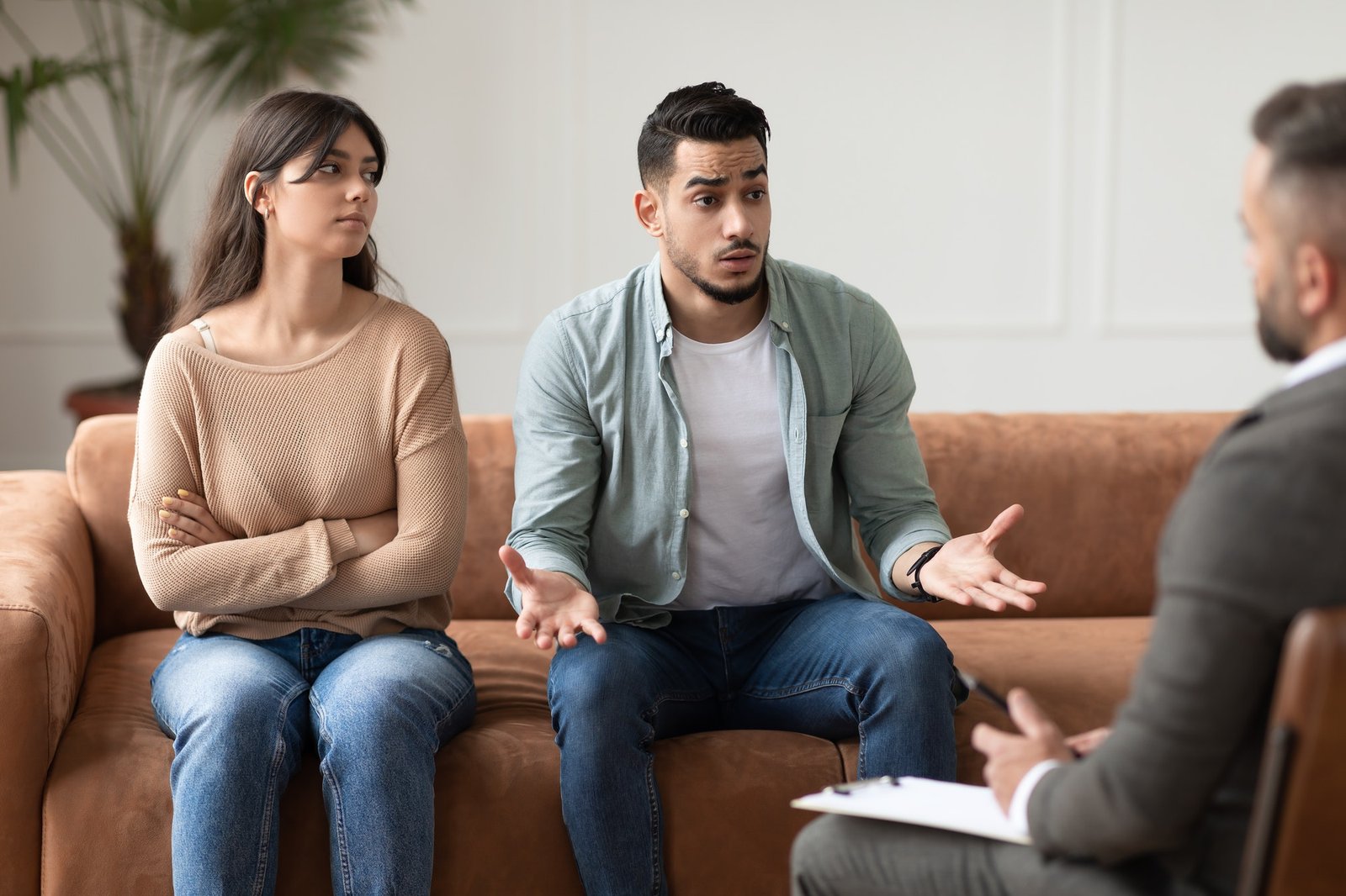 couple-talking-at-therapy-session-with-male-therapist.jpg